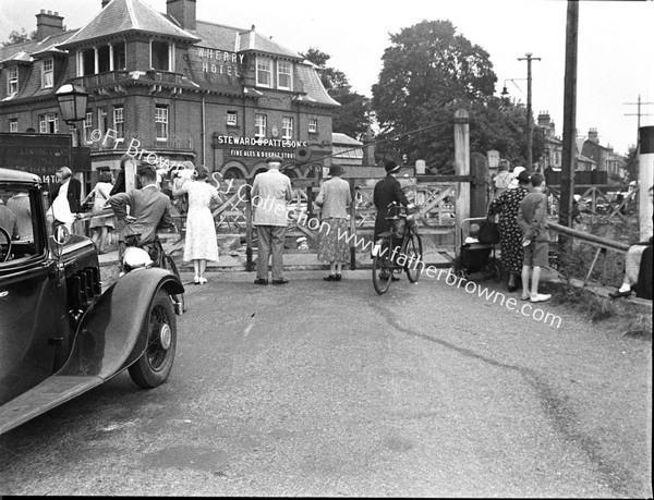 PEOPLE WAIT AT LEVEL CROSSING  WHERRY HOTEL  STEWARD & PATTERSON'S